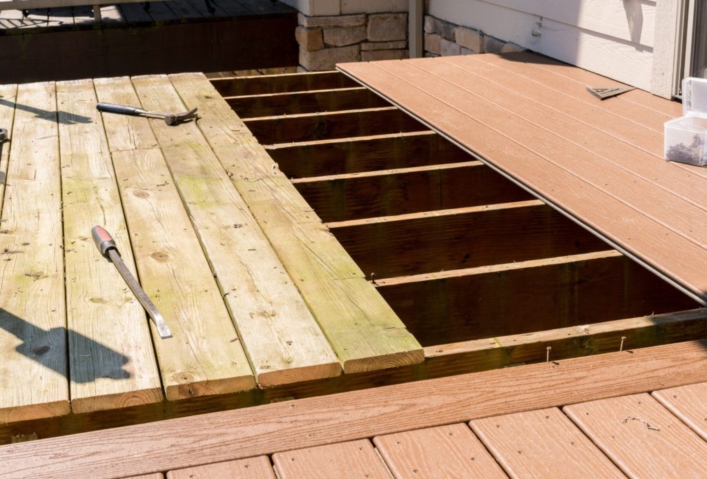 Repair and replacement of an old wooden deck or patio with modern composite plastic material
