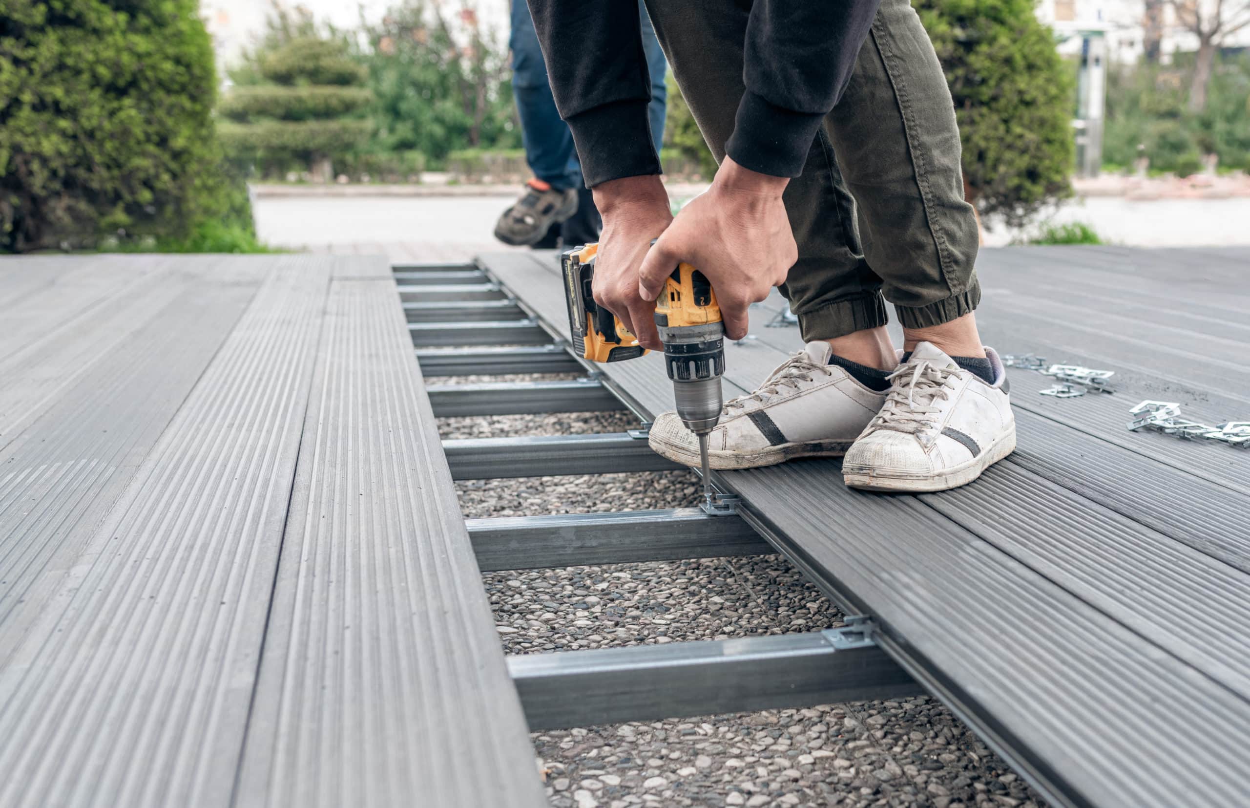 Man assembling composite deck